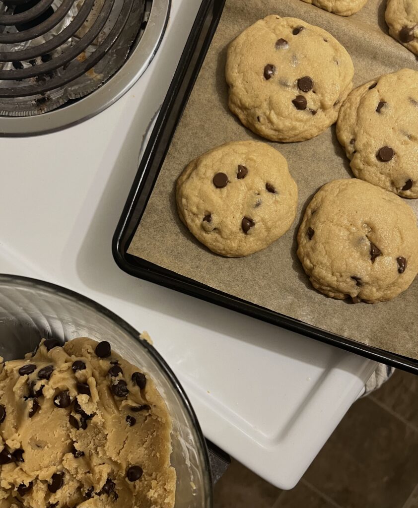 chocolate chip cookies laying on a cookie sheet