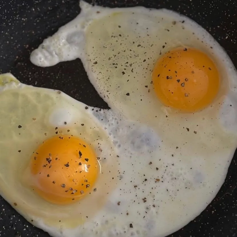 eggs cooking in a pan