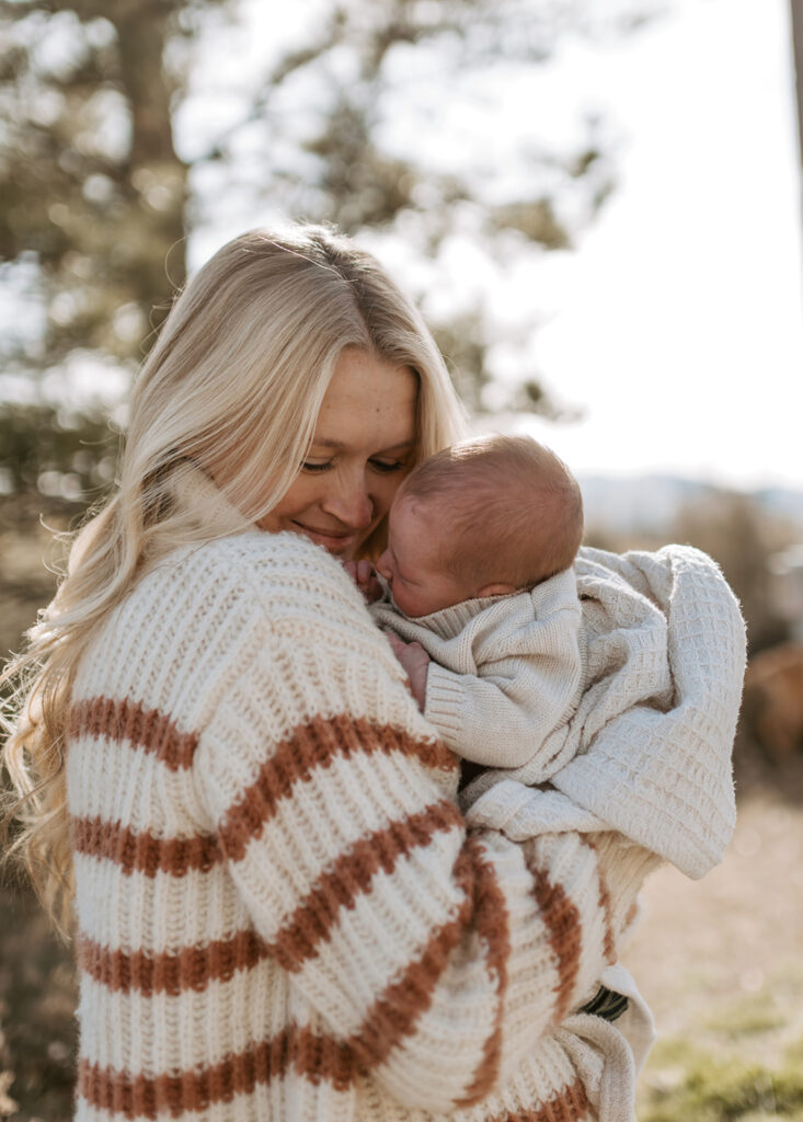 mother and son newborn photo in winter