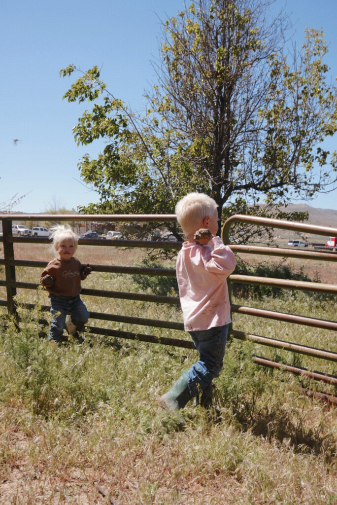ranch kids playing outside in the mud